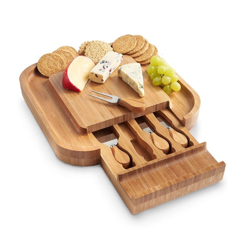Round bamboo cheese board set with cutlery in drawer